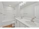 Clean bathroom with double sinks, sleek hardware, and a combined shower-tub at 907 Montague Ave, Durham, NC 27703