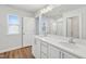 Modern bathroom with double sink vanity, white cabinetry, and glass-enclosed shower for a luxurious feel at 907 Montague Ave, Durham, NC 27703