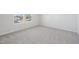 Bright bedroom featuring plush carpeting, neutral walls, and double windows providing natural light at 907 Montague Ave, Durham, NC 27703