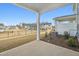 An outdoor patio area is shown with a view of other homes and manicured lawns in the community at 911 Montague Ave, Durham, NC 27703