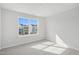 Bright bedroom with soft carpet, a large window, and plenty of natural sunlight at 911 Montague Ave, Durham, NC 27703