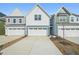 Charming new construction home showcasing a well-manicured lawn and a spacious two-car garage at 911 Montague Ave, Durham, NC 27703