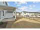 Backyard with newly planted grass, fence, and covered patio at 913 Montague Ave, Durham, NC 27703