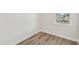 Bright, empty room featuring luxury vinyl floors and large windows with outside views at 913 Montague Ave, Durham, NC 27703