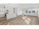 Bright open-concept living space with light wood floors and kitchen with island at 913 Montague Ave, Durham, NC 27703
