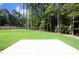 Large backyard with grassy area and patio at 914 Ardmore Dr, Durham, NC 27713