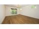 Light-filled bedroom featuring hardwood floors and access to a private balcony at 914 Ardmore Dr, Durham, NC 27713