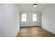 Bright bedroom featuring hardwood floors and two windows at 914 Ardmore Dr, Durham, NC 27713