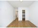 Simple bedroom with hardwood floors and closet at 914 Ardmore Dr, Durham, NC 27713