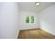 Bright bedroom with hardwood floors and wooded views at 914 Ardmore Dr, Durham, NC 27713