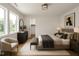 Bright bedroom features a large window with wooded view and stylish furnishings at 914 Ardmore Dr, Durham, NC 27713