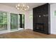 Bedroom with hardwood floors, fireplace, and access to balcony at 914 Ardmore Dr, Durham, NC 27713