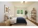 Cozy bedroom with neutral color palette and a large window with backyard views at 914 Ardmore Dr, Durham, NC 27713