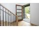 Open entryway with hardwood floors, modern staircase, and a view to the backyard at 914 Ardmore Dr, Durham, NC 27713