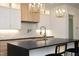 Modern kitchen with large island and gold fixtures at 914 Ardmore Dr, Durham, NC 27713