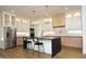 Modern kitchen with stainless steel appliances, quartz countertops, and an island with seating at 914 Ardmore Dr, Durham, NC 27713
