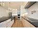 Modern kitchen with a farmhouse sink, quartz countertops, and stainless steel appliances at 914 Ardmore Dr, Durham, NC 27713