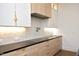 Modern kitchen with light wood cabinets, and black countertops at 914 Ardmore Dr, Durham, NC 27713