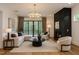 Comfortable living room with a fireplace, chandelier lighting, and sliding doors that let in lots of light at 914 Ardmore Dr, Durham, NC 27713