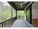 Relaxing screened porch with wooded views and ceiling fan at 914 Ardmore Dr, Durham, NC 27713