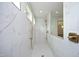 Walk-in shower with marble tile, and gold fixtures at 914 Ardmore Dr, Durham, NC 27713