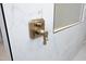 Close up of gold shower fixture and marble tile at 914 Ardmore Dr, Durham, NC 27713