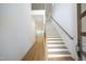 Modern light oak staircase with black metal railing and hardwood floors at 914 Ardmore Dr, Durham, NC 27713