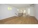 Bright upper level landing with hardwood floors and a modern metal railing at 914 Ardmore Dr, Durham, NC 27713