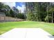 Spacious backyard with a patio and wooded area at 916 Ardmore Dr, Durham, NC 27713