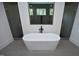 Modern bathroom with freestanding tub and walk-in shower at 916 Ardmore Dr, Durham, NC 27713