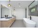 Spa-like bathroom with soaking tub and double sinks at 916 Ardmore Dr, Durham, NC 27713