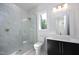 Modern bathroom with a frameless shower, marble tile, and floating vanity at 916 Ardmore Dr, Durham, NC 27713