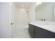 Modern bathroom with updated vanity, bathtub and fixtures at 916 Ardmore Dr, Durham, NC 27713