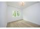 Spacious bedroom with hardwood floors and large windows offering natural light at 916 Ardmore Dr, Durham, NC 27713