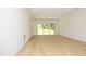 Large bonus room with hardwood floors and sliding glass doors at 916 Ardmore Dr, Durham, NC 27713