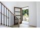 Open entryway with wooden staircase and view of front porch at 916 Ardmore Dr, Durham, NC 27713
