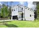 Modern two-story home with white siding, black accents, and a grassy lawn at 916 Ardmore Dr, Durham, NC 27713