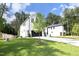 Two-story house with white exterior, black garage door, and landscaped yard at 916 Ardmore Dr, Durham, NC 27713