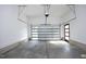 Spacious garage with a modern door and concrete floor at 916 Ardmore Dr, Durham, NC 27713