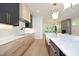 Open concept kitchen with stainless steel appliances and a farmhouse sink at 916 Ardmore Dr, Durham, NC 27713