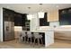 Modern kitchen with dark cabinetry, marble countertops, and island at 916 Ardmore Dr, Durham, NC 27713