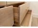 Close-up of light oak kitchen drawers with dovetail joints at 916 Ardmore Dr, Durham, NC 27713