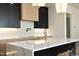 Modern kitchen features white marble countertops and a pot filler faucet at 916 Ardmore Dr, Durham, NC 27713