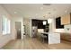 Modern kitchen with white marble island and black cabinetry at 916 Ardmore Dr, Durham, NC 27713