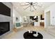 Open living space with a modern fireplace and kitchen view at 916 Ardmore Dr, Durham, NC 27713