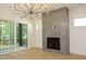 Light-filled living room with hardwood floors, fireplace, and access to outdoor space at 916 Ardmore Dr, Durham, NC 27713