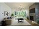 Living room features hardwood floors, fireplace, and large windows at 916 Ardmore Dr, Durham, NC 27713