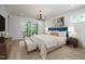 Main bedroom with king-size bed and access to balcony at 916 Ardmore Dr, Durham, NC 27713