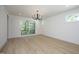 Main bedroom with light walls and hardwood floors at 916 Ardmore Dr, Durham, NC 27713
