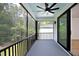 Relaxing screened porch with ceiling fan overlooking wooded area at 916 Ardmore Dr, Durham, NC 27713